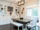 Elegant dining room with a large table, upholstered chairs, and built-in display cabinets at 286 Two Creeks Lp, Chapel Hill, NC 27517