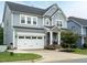 Charming two-story home with a two-car garage and inviting front porch at 286 Two Creeks Lp, Chapel Hill, NC 27517