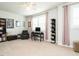 Spacious flex room with comfortable seating, built-in shelving, and a computer setup at 286 Two Creeks Lp, Chapel Hill, NC 27517