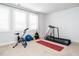 Home gym with a treadmill, exercise bike, yoga mat, and free weights for a complete workout at 286 Two Creeks Lp, Chapel Hill, NC 27517