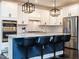 Modern kitchen featuring white cabinets, stainless steel appliances, and a large island with barstool seating at 286 Two Creeks Lp, Chapel Hill, NC 27517