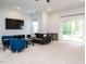 Open living room features a TV, and access to a deck with a sliding glass door at 286 Two Creeks Lp, Chapel Hill, NC 27517
