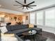 Cozy living room boasts gray sectional, dining area and window with natural light at 286 Two Creeks Lp, Chapel Hill, NC 27517