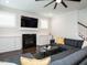 Cozy living room with a fireplace, built-in shelving, and comfortable seating at 286 Two Creeks Lp, Chapel Hill, NC 27517