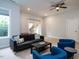 Living room with neutral walls, carpet, ceiling fan and access to a deck via a glass sliding door at 286 Two Creeks Lp, Chapel Hill, NC 27517