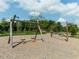 Community playground featuring swings and play equipment, providing a fun outdoor space at 286 Two Creeks Lp, Chapel Hill, NC 27517