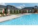 Outdoor pool with lounge chairs and manicured greenery provides a resort-like experience at 286 Two Creeks Lp, Chapel Hill, NC 27517