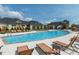 Large swimming pool surrounded by lounge chairs and well-maintained landscaping at 286 Two Creeks Lp, Chapel Hill, NC 27517
