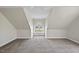 Large carpeted bonus room with dormer windows and attic ceiling at 2905 Whitehart Ln, Raleigh, NC 27606
