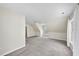 Large carpeted bonus room with attic ceiling and windows at 2905 Whitehart Ln, Raleigh, NC 27606