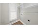 Walk-in closet featuring shelving, a rod for hanging clothes and a window for light at 2905 Whitehart Ln, Raleigh, NC 27606