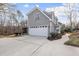 Charming home featuring a two-car garage, screened porch, and landscaped walkway, all in a serene setting at 2905 Whitehart Ln, Raleigh, NC 27606