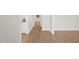 Bright hallway with wood floors, white trim, and fresh neutral paint at 2905 Whitehart Ln, Raleigh, NC 27606