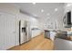 Bright kitchen with stainless steel appliances, dark countertops and white cabinets at 2905 Whitehart Ln, Raleigh, NC 27606