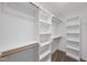 Spacious walk-in closet with built-in shelves and hanging rods at 2905 Whitehart Ln, Raleigh, NC 27606