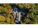Gorgeous home surrounded by colorful autumn trees and private pool area at 303 Laurel Hill Road, Chapel Hill, NC 27514