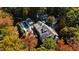 Stunning aerial view of home, pool, landscaping, and solar panels at 303 Laurel Hill Road, Chapel Hill, NC 27514