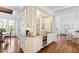 Convenient bar area equipped with wine cooler, granite countertop, and custom cabinets for drinks at 303 Laurel Hill Road, Chapel Hill, NC 27514