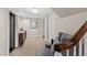 Spacious carpeted basement with a bar area, comfortable seating, and ample storage at 303 Laurel Hill Road, Chapel Hill, NC 27514