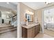 Elegant bathroom features granite countertops, stylish fixtures, and views into the main bedroom and the hall at 303 Laurel Hill Road, Chapel Hill, NC 27514