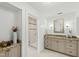 Light and bright bathroom with glass shower and granite countertops on the stylish vanity at 303 Laurel Hill Road, Chapel Hill, NC 27514