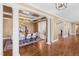 Formal dining room boasts coffered ceilings, hardwood floors, and stylish chandelier creating an elegant space at 303 Laurel Hill Road, Chapel Hill, NC 27514
