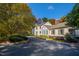 Attractive home exterior with well-maintained lawn and mature trees at 303 Laurel Hill Road, Chapel Hill, NC 27514