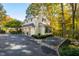 Well-maintained home exterior with a three-car garage and manicured landscaping at 303 Laurel Hill Road, Chapel Hill, NC 27514