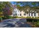 Two-story home with classic architectural details, complemented by a well-maintained front yard at 303 Laurel Hill Road, Chapel Hill, NC 27514