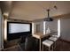 Home theater has tiered seating, a large screen, a granite bar with seating, and ambient lighting at 303 Laurel Hill Road, Chapel Hill, NC 27514