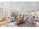 Bright living room with vaulted ceilings, fireplace, French doors, and open to the kitchen at 303 Laurel Hill Road, Chapel Hill, NC 27514