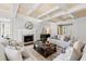 Cozy living room featuring a fireplace, plush sofas, and stylish decor, creating a comfortable space at 303 Laurel Hill Road, Chapel Hill, NC 27514