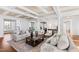 Bright living room with coffered ceilings, hardwood floors, and an open layout perfect for entertaining at 303 Laurel Hill Road, Chapel Hill, NC 27514