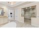 Main bathroom featuring a glass shower, a vanity and elegant neutral finishes at 303 Laurel Hill Road, Chapel Hill, NC 27514
