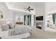 Spacious primary bedroom with a fireplace, sitting area and large windows at 303 Laurel Hill Road, Chapel Hill, NC 27514