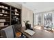 Office with wood floors, built-in bookshelves, and a view to the outside at 303 Laurel Hill Road, Chapel Hill, NC 27514