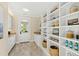 Pantry with granite counters and built-in shelving and cabinets at 303 Laurel Hill Road, Chapel Hill, NC 27514