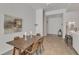 Well-lit dining room featuring a wooden table, modern chairs, and neutral walls at 319 Fayetteville St # 509, Raleigh, NC 27601