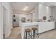 Open kitchen with stainless steel appliances, white cabinets, and bar seating at 319 Fayetteville St # 509, Raleigh, NC 27601