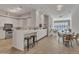 Modern kitchen featuring white cabinets, countertops, and a breakfast bar with seating at 319 Fayetteville St # 509, Raleigh, NC 27601
