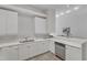 A kitchen with white cabinetry, stainless steel appliances, and a functional layout at 319 Fayetteville St # 509, Raleigh, NC 27601