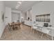 Bright open floor plan with dining area, kitchen, and a white work desk with modern chairs at 319 Fayetteville St # 509, Raleigh, NC 27601