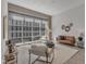 Sun-filled living room with stylish furniture, decor, and floor to ceiling windows at 319 Fayetteville St # 509, Raleigh, NC 27601