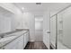 Bathroom featuring a dual sink vanity with granite countertop and walk-in shower at 3517 Strawberry Patch Row, Raleigh, NC 27604