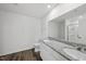 Bathroom featuring a dual sink vanity with granite countertop and walk-in shower at 3517 Strawberry Patch Row, Raleigh, NC 27604