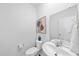 Modern half bathroom with a toilet and a sink with a mirror on the wall at 3517 Strawberry Patch Row, Raleigh, NC 27604