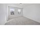 Well-lit bedroom with neutral carpet, two windows providing plenty of natural light and ventilation at 3517 Strawberry Patch Row, Raleigh, NC 27604