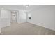 Neutral bedroom showcasing plush carpeting, a large window, and ample natural light at 3517 Strawberry Patch Row, Raleigh, NC 27604
