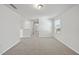 Neutral bedroom showcasing plush carpeting, a large window, and ample natural light at 3517 Strawberry Patch Row, Raleigh, NC 27604