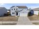 Attractive home boasts a two-car garage and manicured landscaping, complemented by blue siding and a welcoming entrance at 3517 Strawberry Patch Row, Raleigh, NC 27604